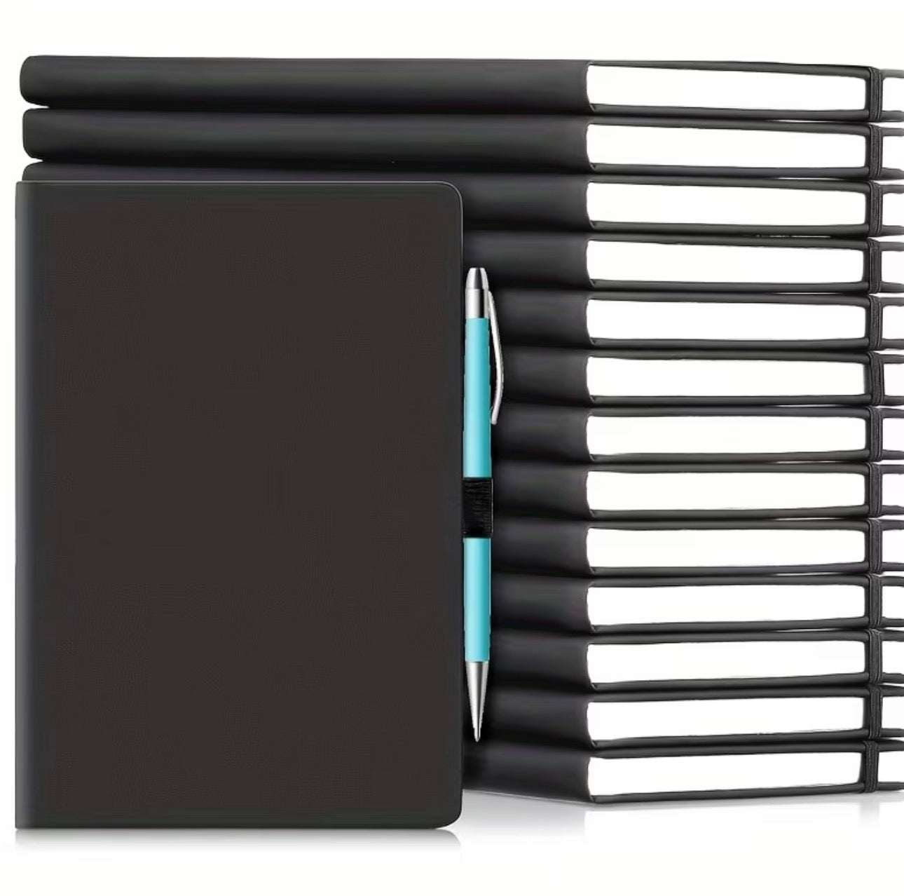 Black notebook with a pen and stack of black notebooks on a white background