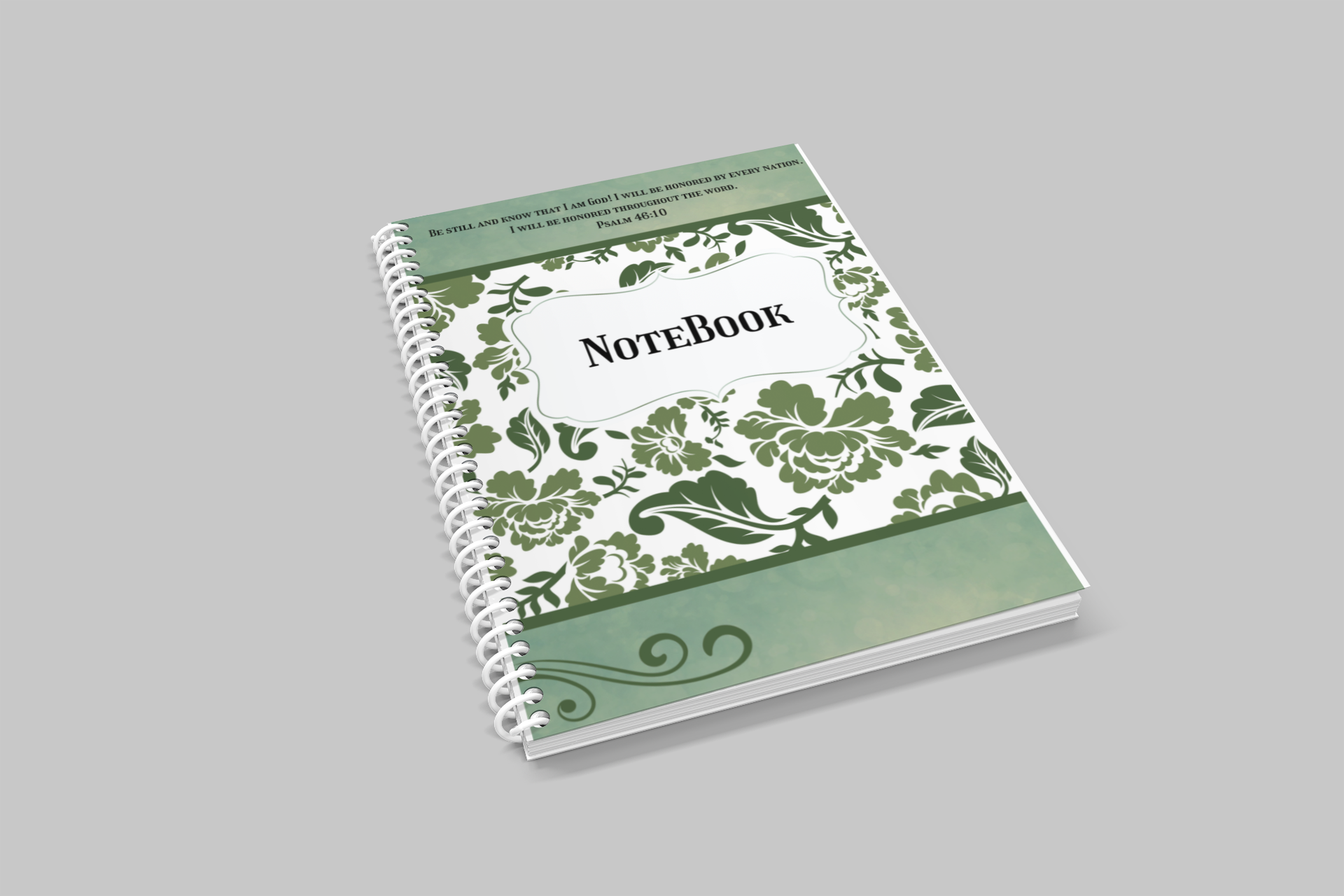 Notebook with green floral design on a gray background