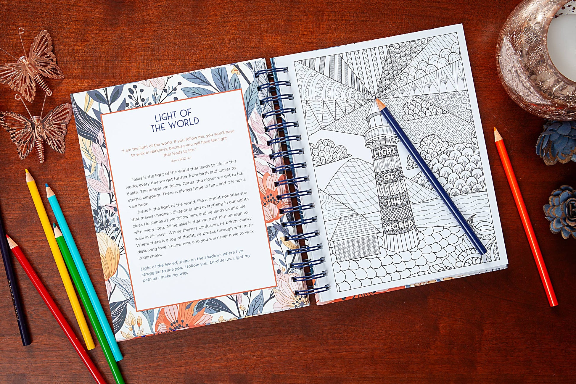 Bible Word Search devotional book on a wooden surface with a colored pencils.