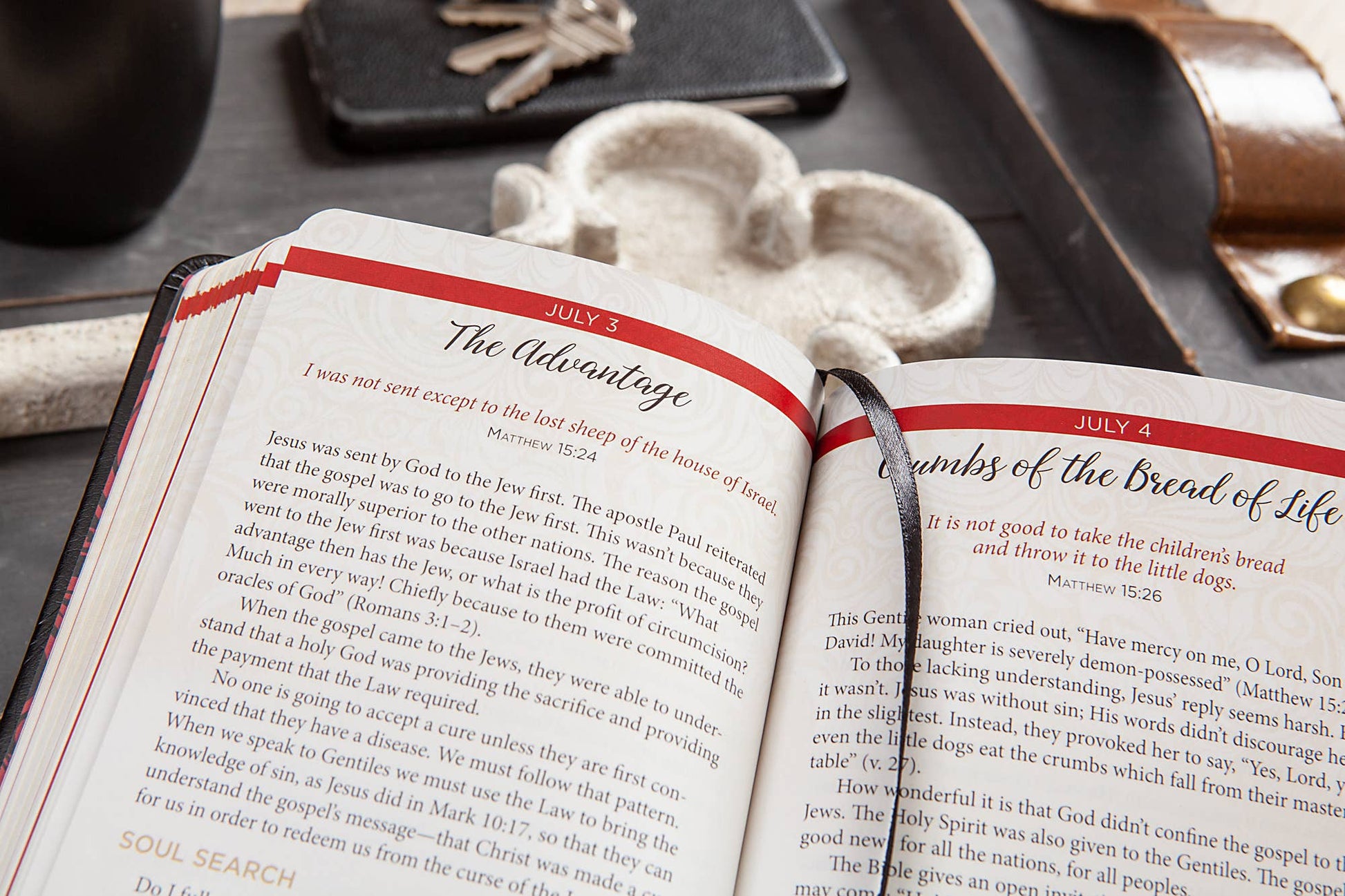 Open book with religious text on a wooden surface
