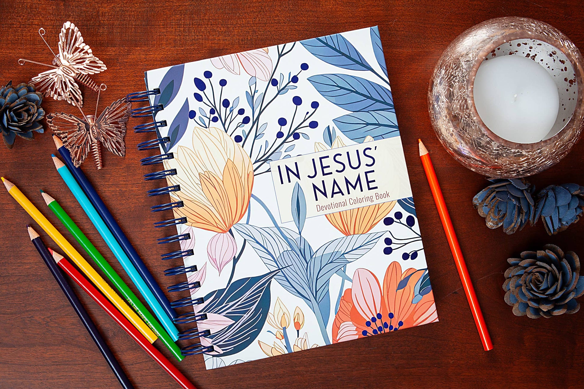 Bible Word Search devotional book on a wooden surface with a colored pencils.
