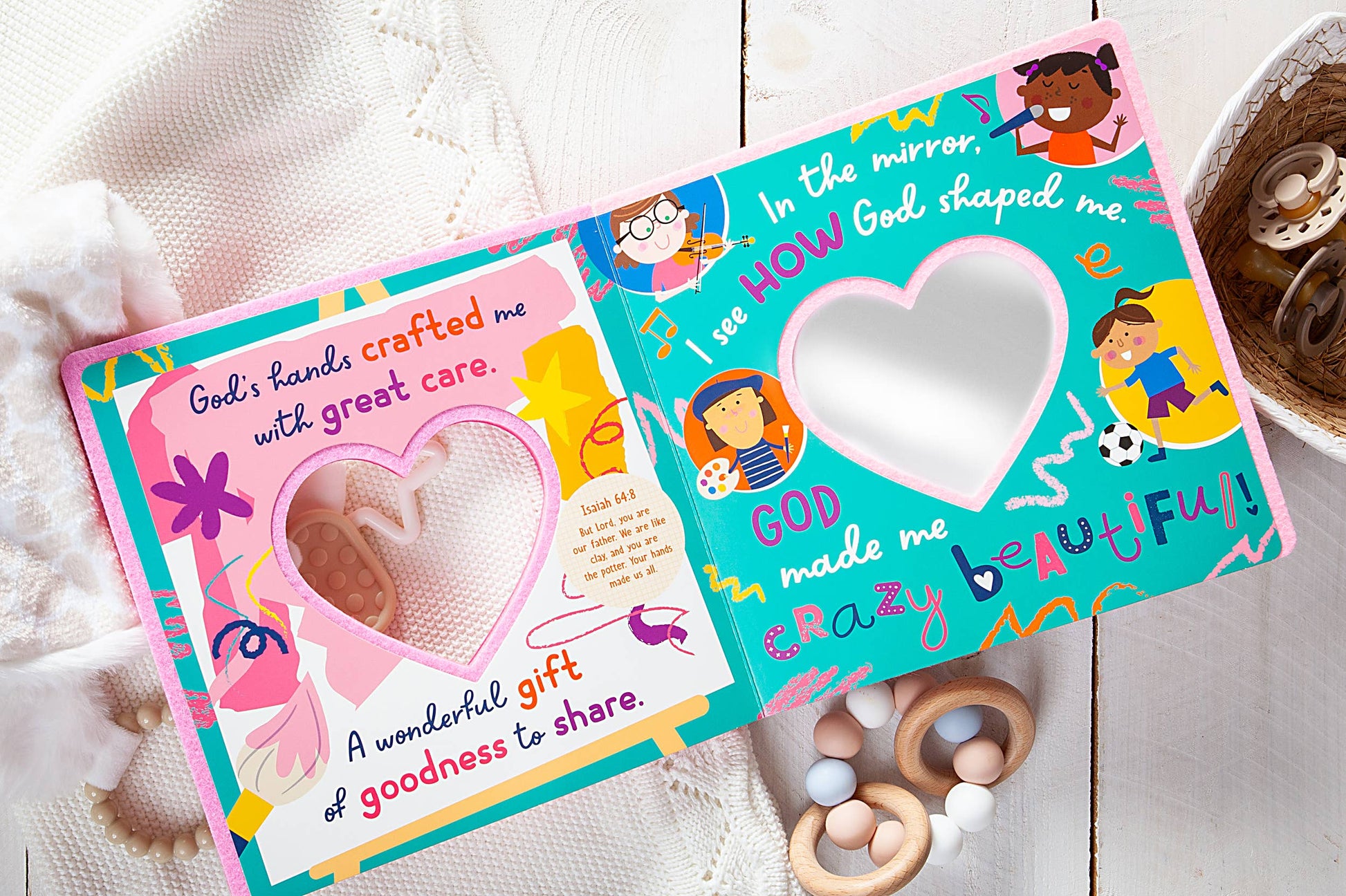 Children's book with heart-shaped mirror on a wooden surface