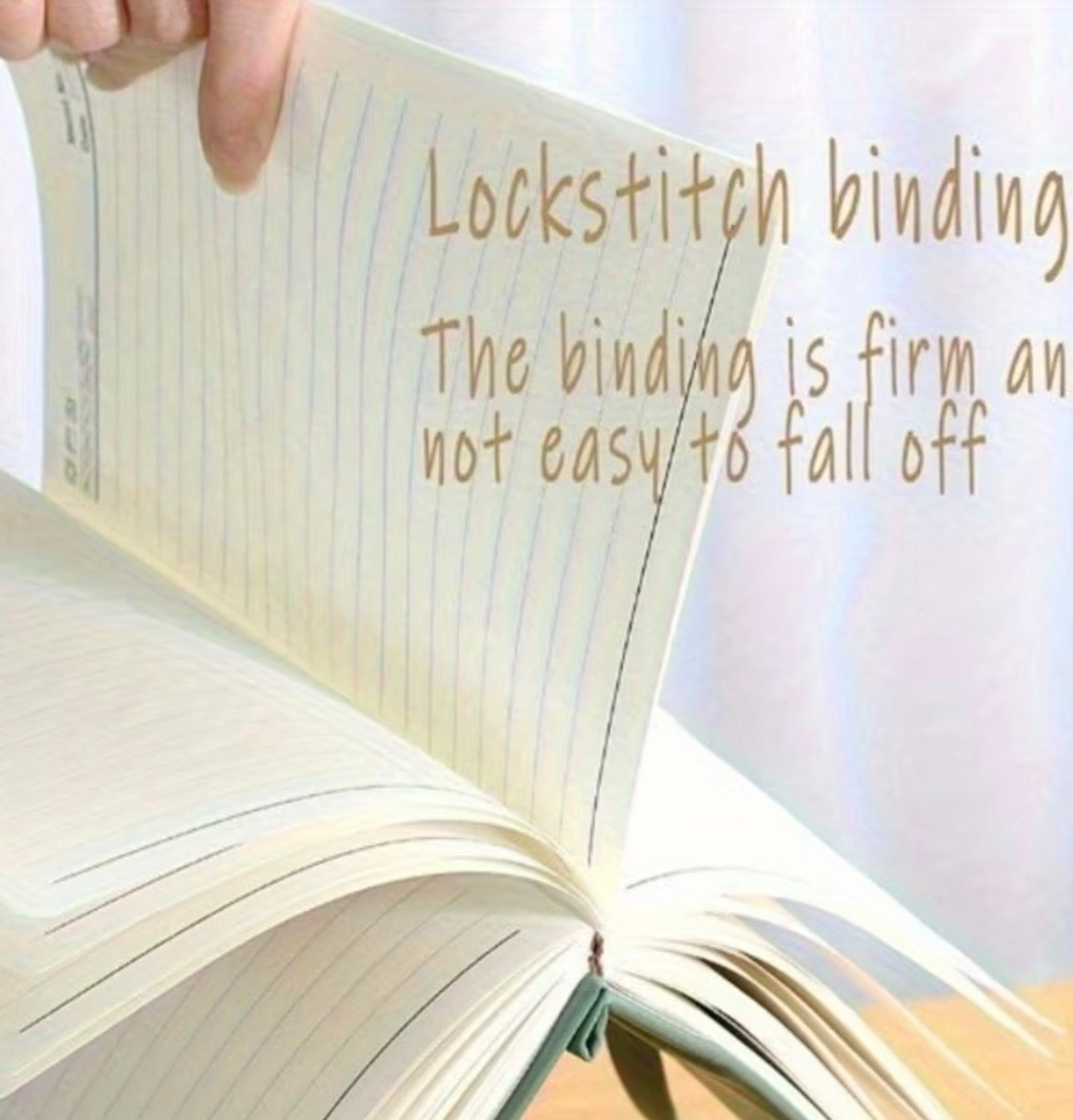 Open notebook with text about lockstitch binding on a light background