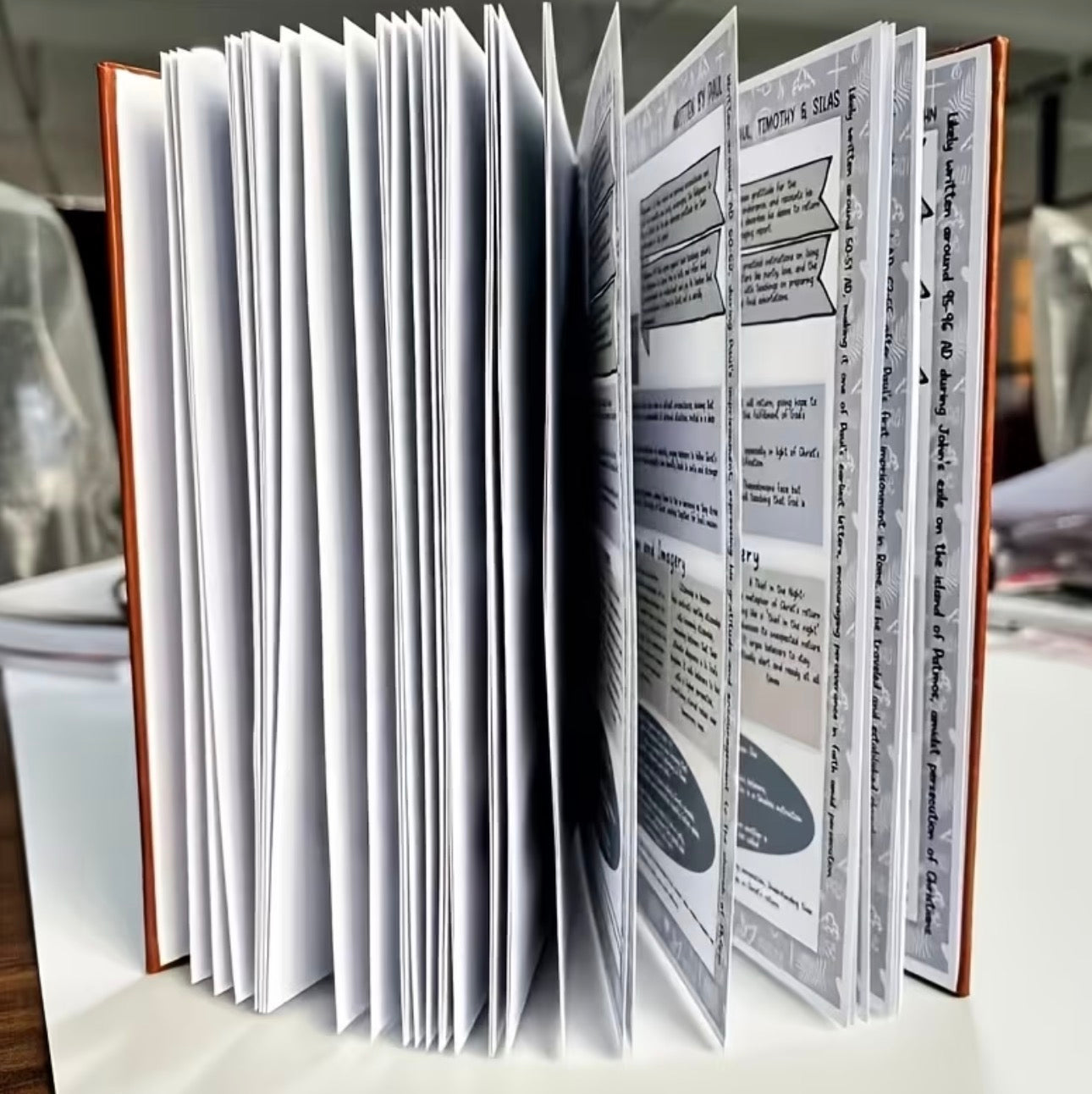 Open book with text and images on a blurred background
