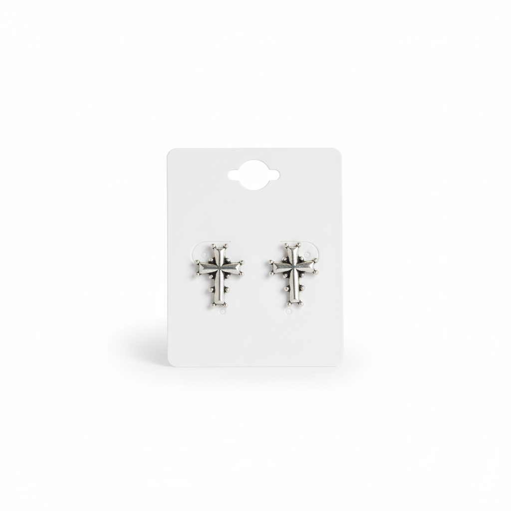 "Silver-Toned Cross Earrings with Embellishments."