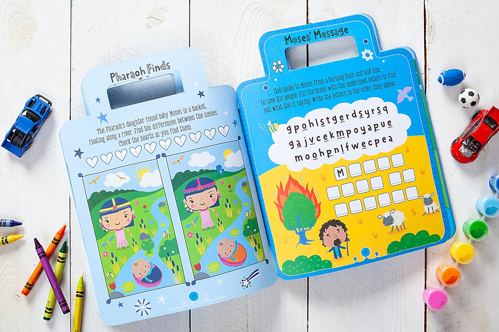 Children's educational toys with colorful illustrations and text on a wooden surface.