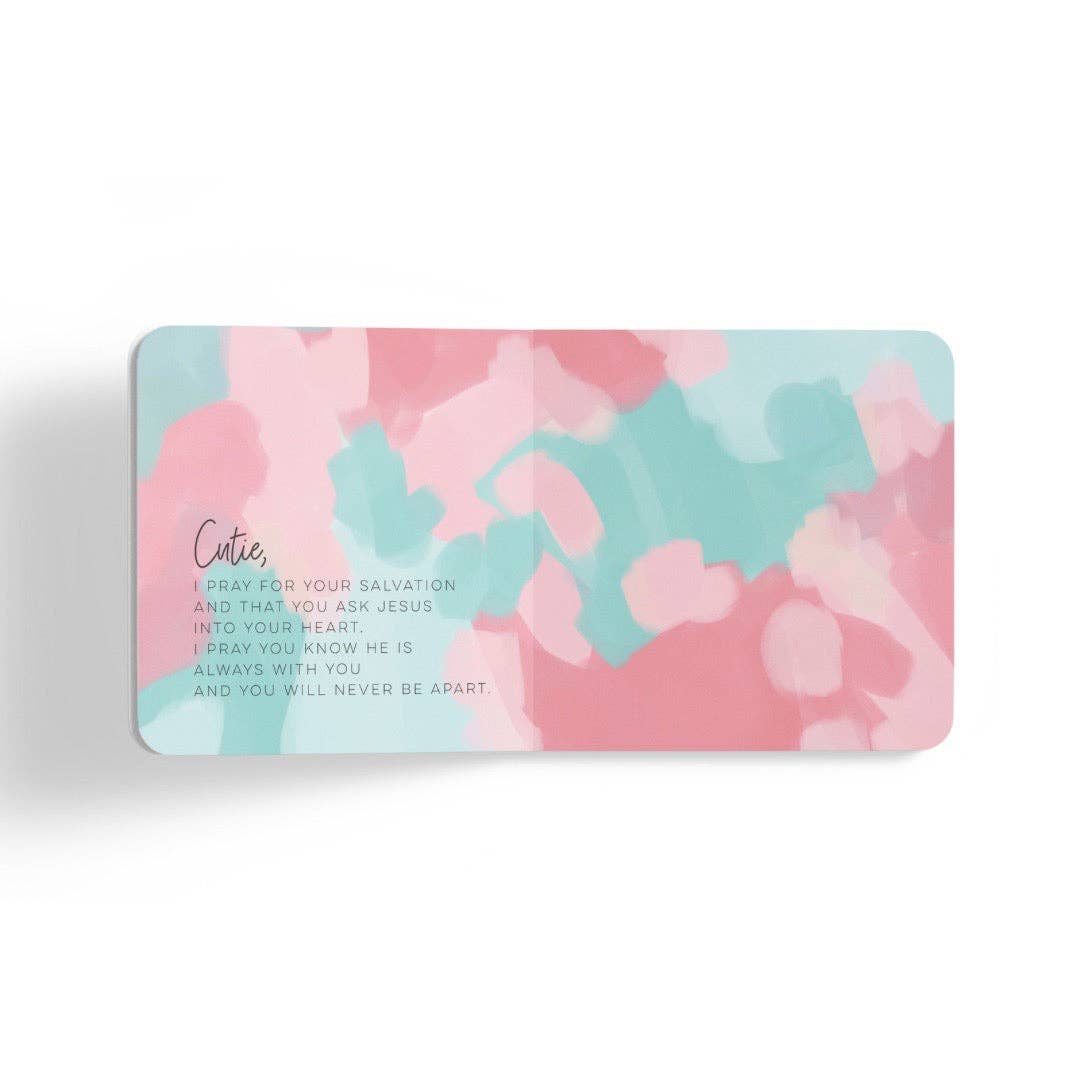 Pink and blue prayer card with a geometric design on a white background