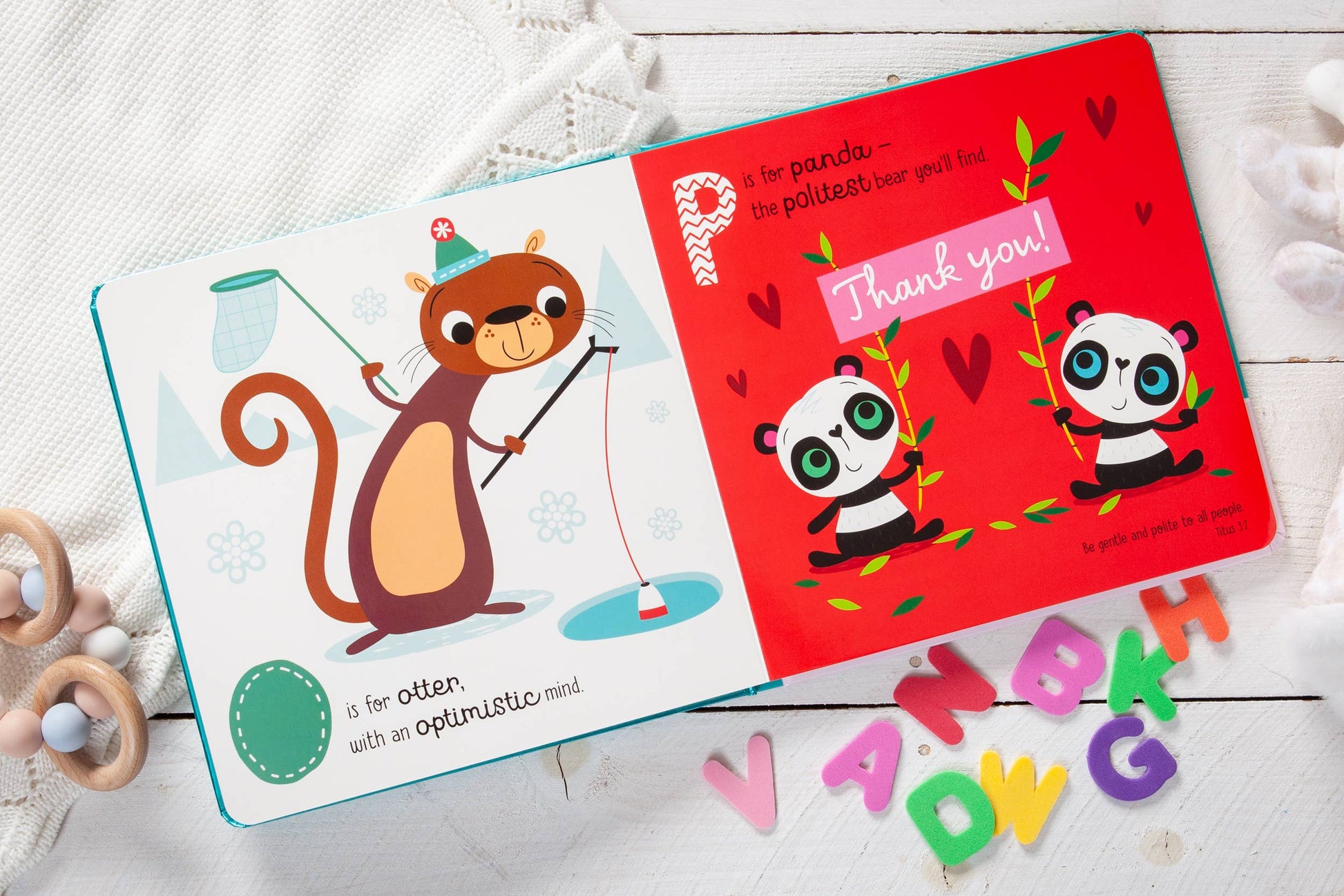 Children's book with a squirrel illustration and a panda-themed page on a white surface.